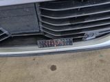 a sticker on the front bumper of a car