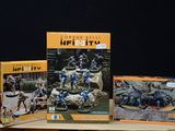 two boxes of action figures on a table
