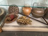 a glass display case with a variety of items on it