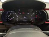 a close up of a car dashboard with a speedometer and gauges