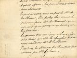 a handwritten letter written in black ink on a piece of paper