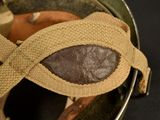 a close up of a helmet with a bandage on it