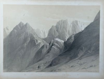 an old picture of a mountain scene with a person on a horse in the foreground