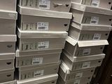boxes stacked on top of each other on the floor in a store