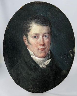 portrait of a young man in a black coat and white shirt
