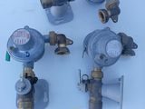 four different types of gas valves on a table with a price tag