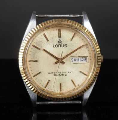 an image of a close up of a wrist watch on a table