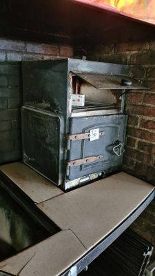 an old oven sitting on top of a counter in a kitchen