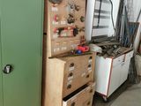 a green cabinet and a green cabinet in a garage
