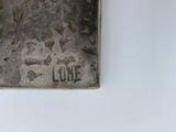 a silver lighter that is sitting on a table