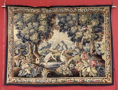 a tapestry hanging on the wall of a room