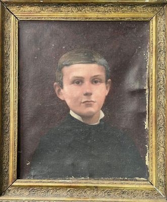portrait of a young man in a black shirt and a hat
