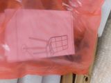 a picture of a piece of pink paper in a plastic bag