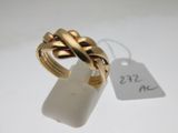 an image of a gold ring with a knot on it
