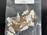 a bag of gold and silver jewelry on a table