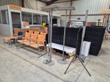 many chairs and tables in a building with a lot of windows