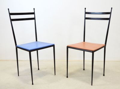 two chairs sitting next to each other in a room