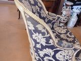 a chair that is sitting on a rug in a room
