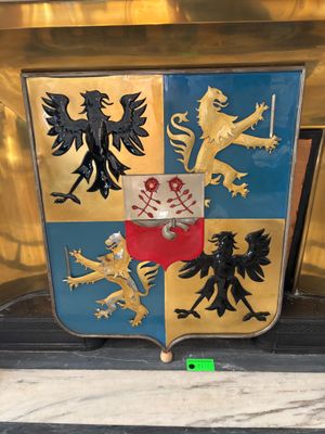a coat of arms on display in a building