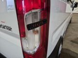 a close up of the tail light of a white truck