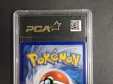 a close up of a pokemon card in a plastic case