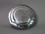 a silver plate that is sitting on a table