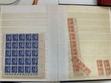 an open book with stamps on it sitting on a table