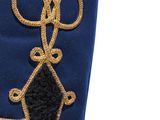 a close up of a blue uniform with a gold decoration
