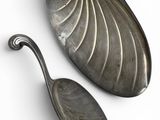 pair of silver plated spoons on a white background
