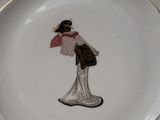 a white plate with a picture of a woman on it