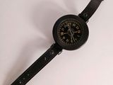 a watch that is sitting on a white surface