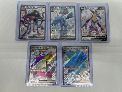 four different types of pokemon trading cards in plastic cases