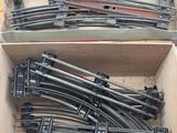 a lot of train tracks in a box on a table