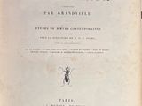 an old book with a bug on it sitting on a table