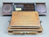 a small wooden box with a drawer on top of it