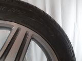 a close up of a tire on a white surface
