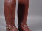pair of brown leather riding boots with buckles and buckles