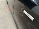a sticker on the side of a black car