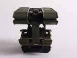a toy army vehicle with a missile on top of it