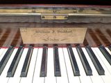 a close up of a piano keyboard with a box on it