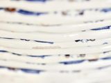 a stack of plates with blue and white designs on them