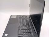 a laptop computer sitting on top of a white table