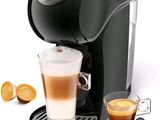 an image of a coffee maker with a cup of coffee next to it