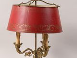 an image of a lamp with a red shade on a table