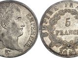 a silver coin with an image of a woman in profile