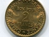 l'image d'une pièce de monnaie sur laquelle figure le chiffre 2