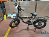 a bicycle that is sitting on the floor in a warehouse