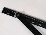 a picture of a square ruler on a table