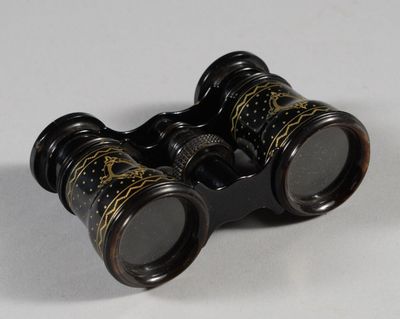 a pair of binoculars that are sitting on a table