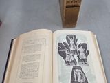 an open book sitting on a table next to a box